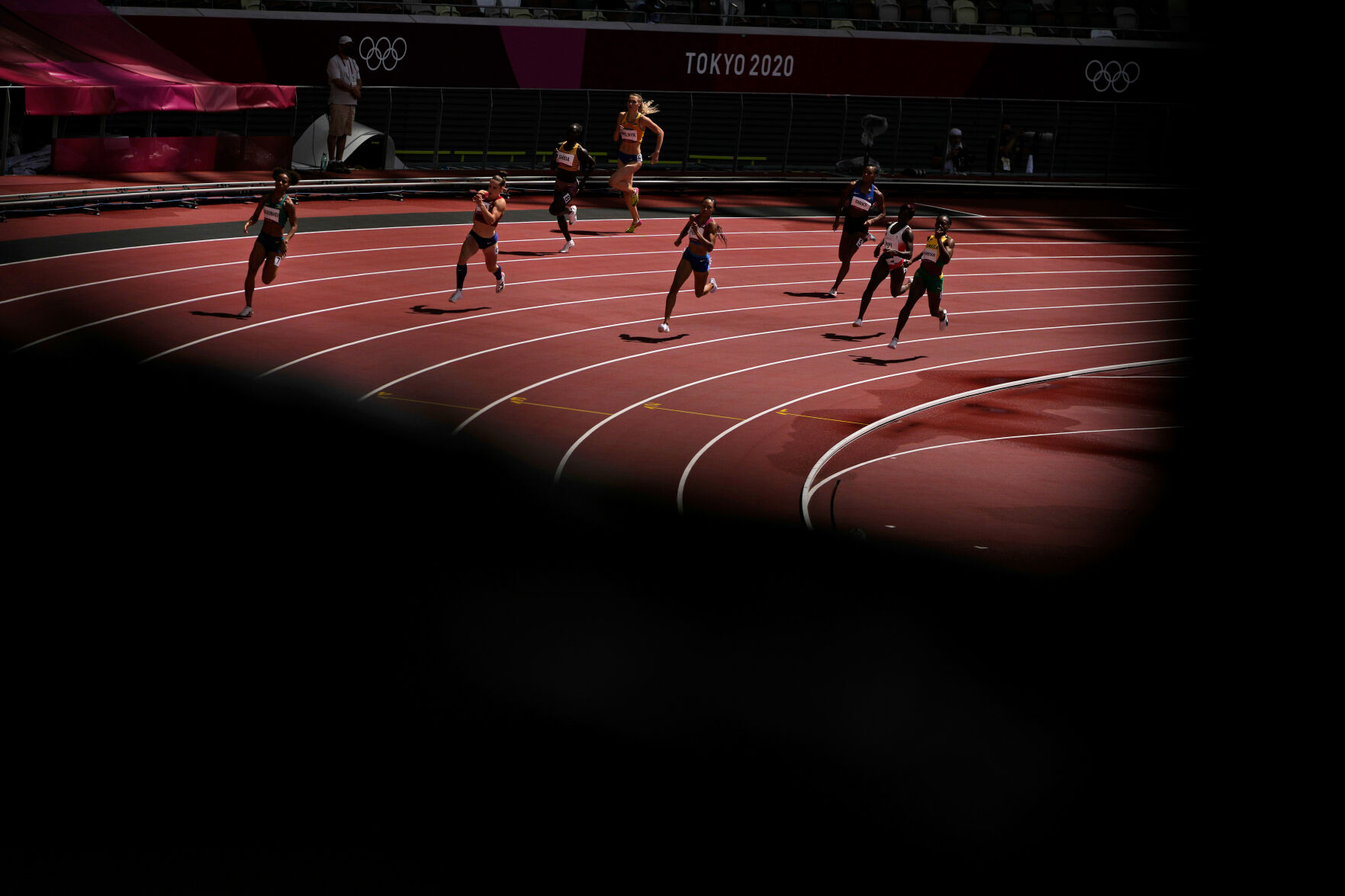 Runners compete in the women's 400
